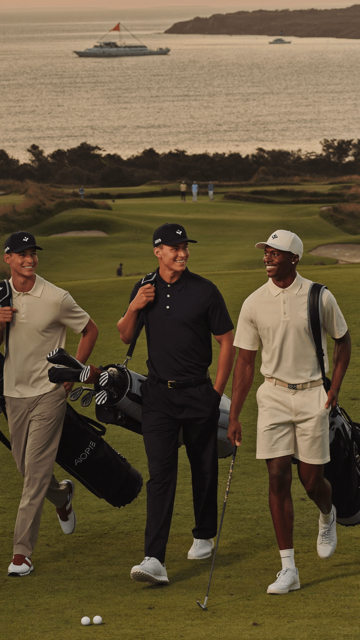 Golfers wearing House of Par clothing walking on a links course at sunrise